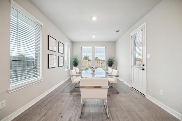 dining room with wood-type flooring