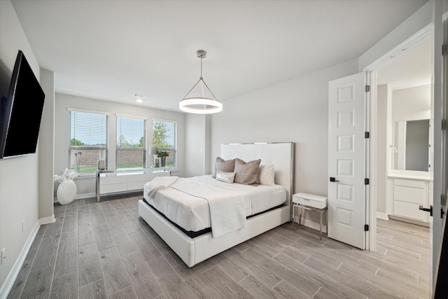 bedroom with hardwood / wood-style flooring