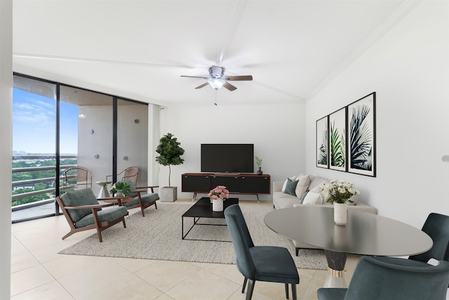 living room featuring a wall of windows, crown molding, light tile patterned flooring, and ceiling fan