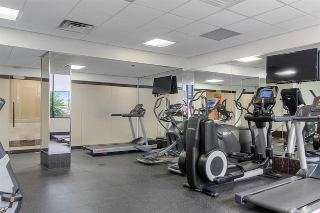 gym featuring a paneled ceiling