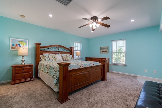 bedroom featuring light carpet and ceiling fan