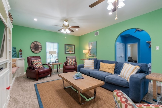 22921 Chiquita St, Galveston, TX 77554 - living room featuring visible vents, arched walkways, baseboards, light colored carpet, and ceiling fan