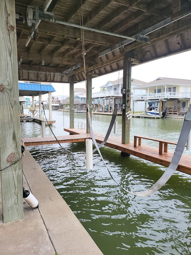 22921 Chiquita St, Galveston, TX 77554 - dock area featuring a water view and boat lift
