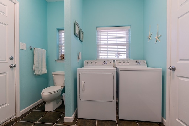 22921 Chiquita St, Galveston, TX 77554 - clothes washing area featuring dark tile patterned flooring, independent washer and dryer, and laundry area