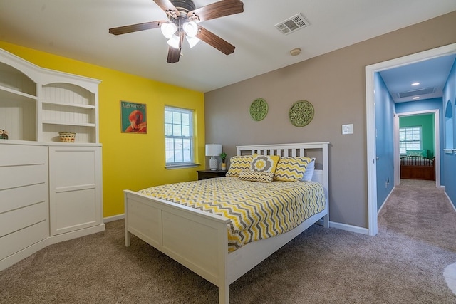 carpeted bedroom with ceiling fan