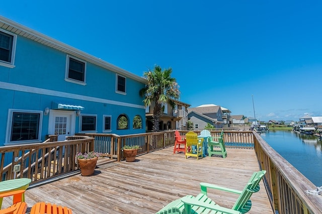 22921 Chiquita St, Galveston, TX 77554 - wooden deck featuring a water view