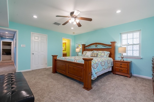 bedroom with ceiling fan and light carpet