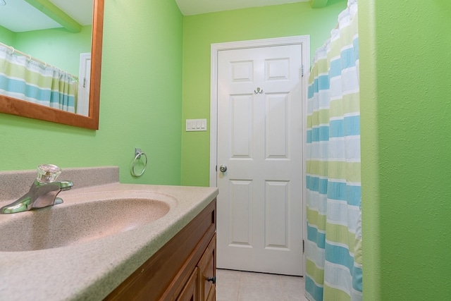 bathroom with vanity, a shower with shower curtain, and tile patterned floors