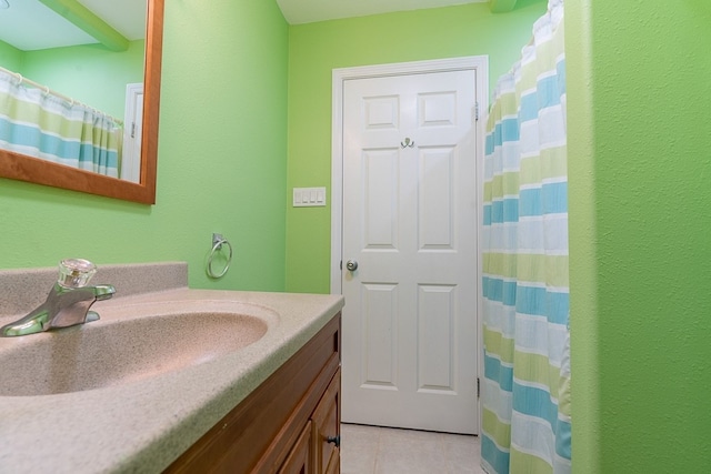 22921 Chiquita St, Galveston, TX 77554 - full bath with tile patterned flooring, vanity, and a shower with curtain