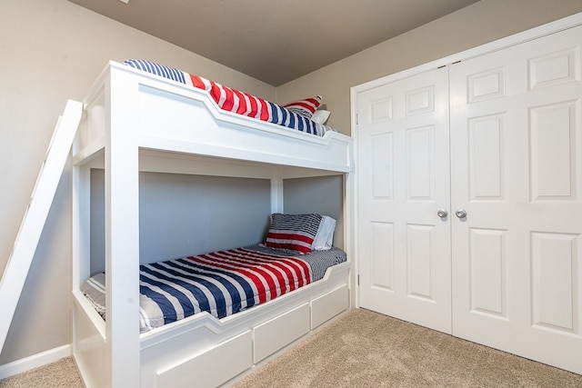 bedroom with a closet and carpet flooring