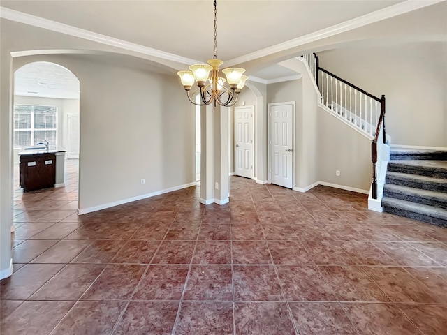 unfurnished dining area featuring crown molding, a chandelier, and tile patterned floors