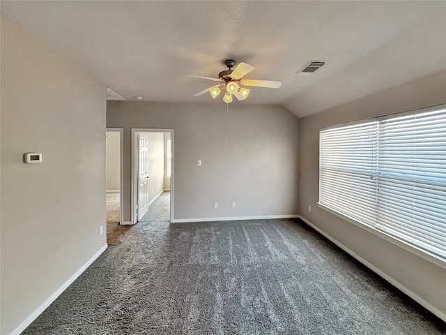 carpeted spare room with lofted ceiling and ceiling fan