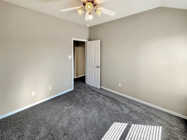 carpeted spare room with lofted ceiling and ceiling fan