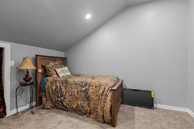 bedroom featuring vaulted ceiling and light carpet