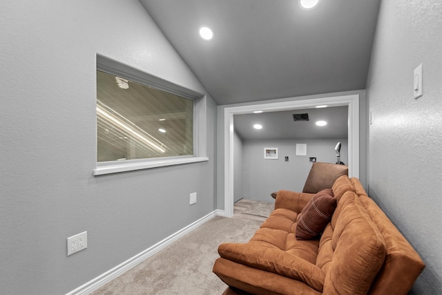 interior space featuring lofted ceiling and light carpet