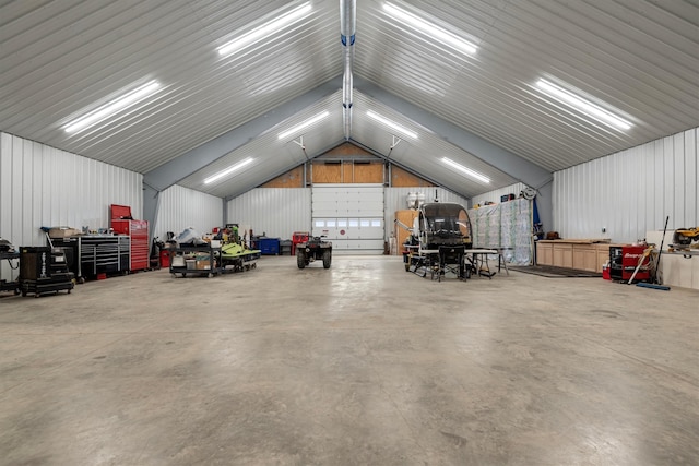 garage featuring wood walls