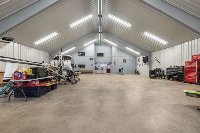 garage featuring wooden walls