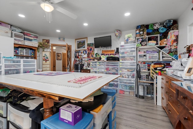 interior space with ceiling fan