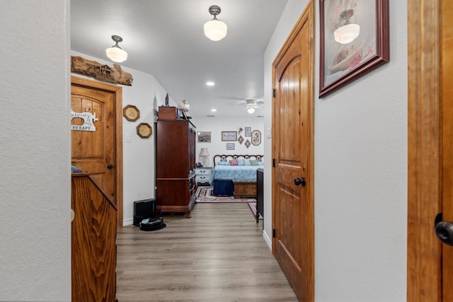 corridor featuring light hardwood / wood-style flooring