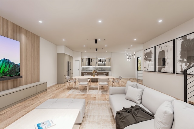 living room featuring an inviting chandelier and light wood-type flooring