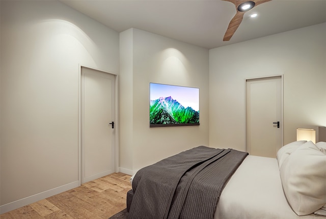 bedroom featuring light hardwood / wood-style floors and ceiling fan