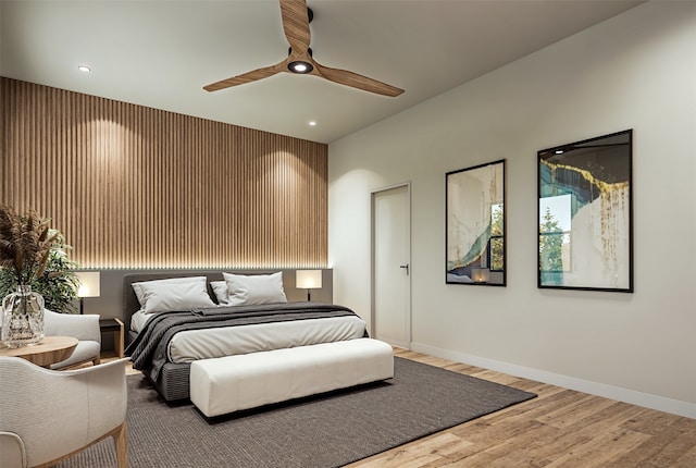 bedroom featuring ceiling fan and hardwood / wood-style floors