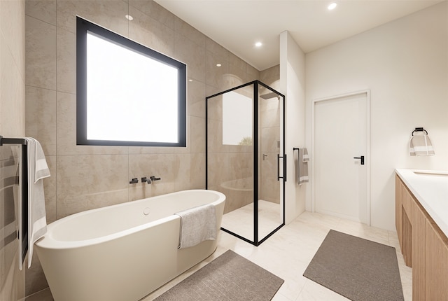 bathroom featuring vanity, plus walk in shower, and tile patterned floors