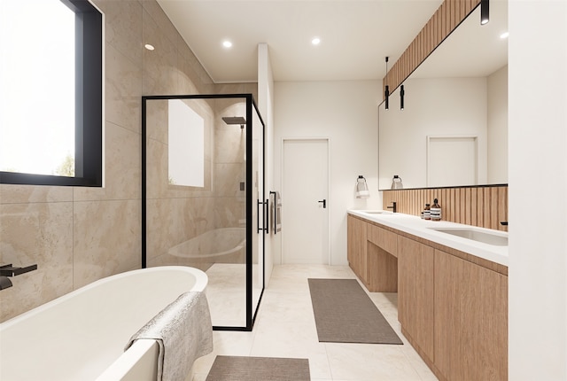 bathroom featuring shower with separate bathtub, tile patterned flooring, and vanity