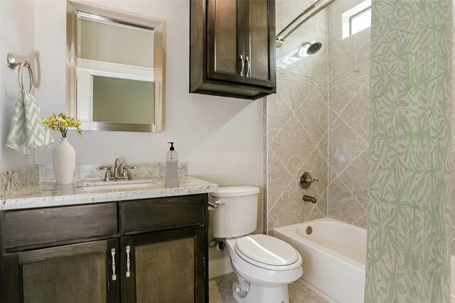 full bathroom featuring vanity, toilet, and tiled shower / bath combo