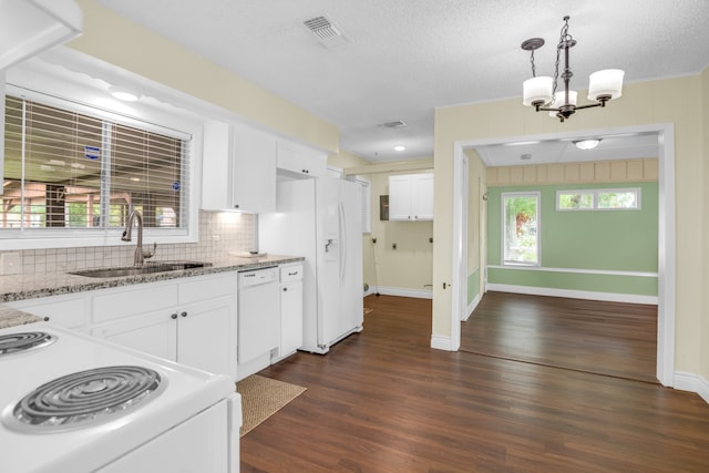 kitchen featuring pendant lighting, white cabinetry, white appliances, dark hardwood / wood-style flooring, and sink