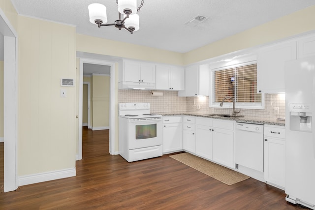 kitchen with custom exhaust hood, white appliances, a chandelier, sink, and dark wood-type flooring