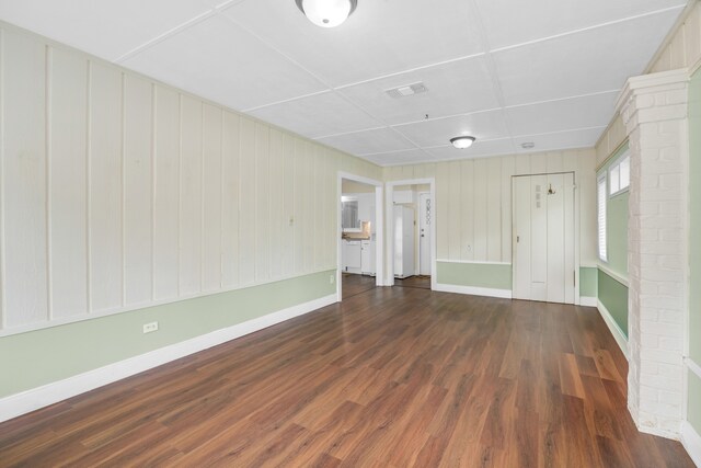 spare room with hardwood / wood-style flooring