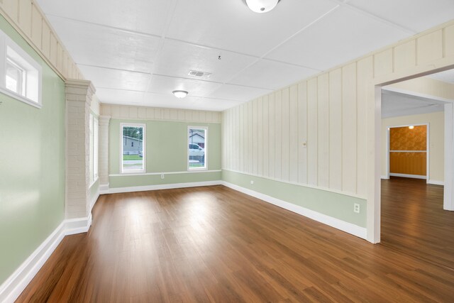 spare room with dark hardwood / wood-style floors