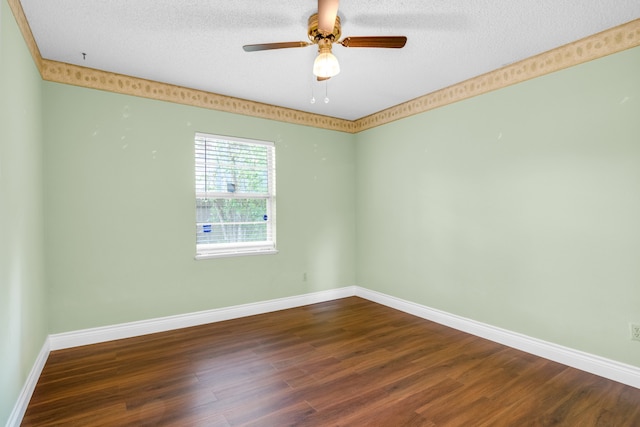 spare room with hardwood / wood-style floors, ceiling fan, and a textured ceiling