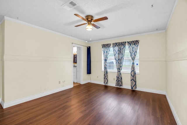 spare room with wood-type flooring, ornamental molding, a textured ceiling, and ceiling fan