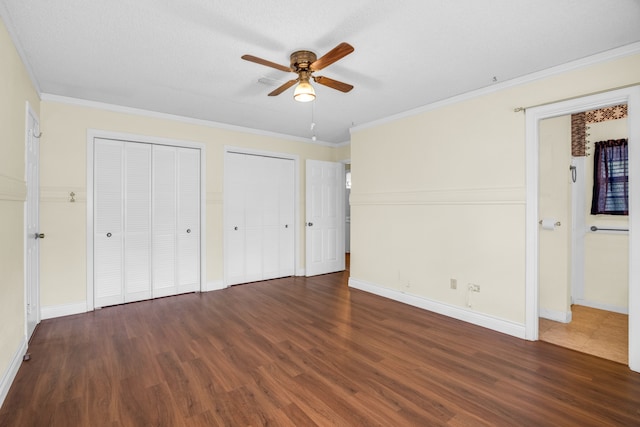 unfurnished bedroom featuring a textured ceiling, ceiling fan, ornamental molding, and dark hardwood / wood-style flooring