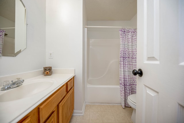 full bathroom featuring tile patterned floors, toilet, shower / bath combination with curtain, vanity, and a textured ceiling