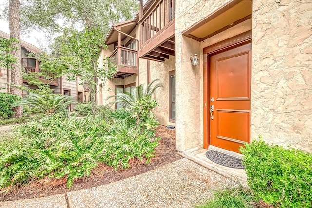 doorway to property featuring a balcony