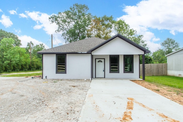 1022 Adams St, Cleveland, TX 77327 - view of front of property featuring a shingled roof and concrete driveway