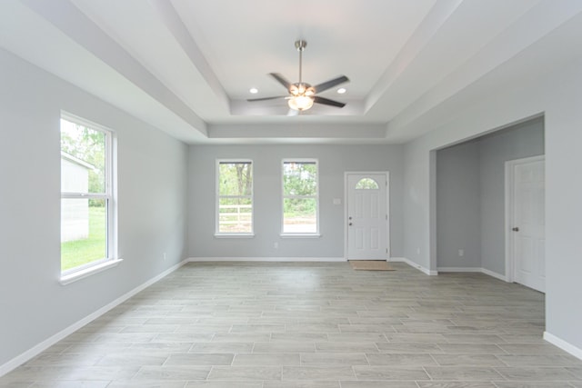 1022 Adams St, Cleveland, TX 77327 - foyer entrance with ceiling fan, a tray ceiling, baseboards, light wood-type flooring, and recessed lighting
