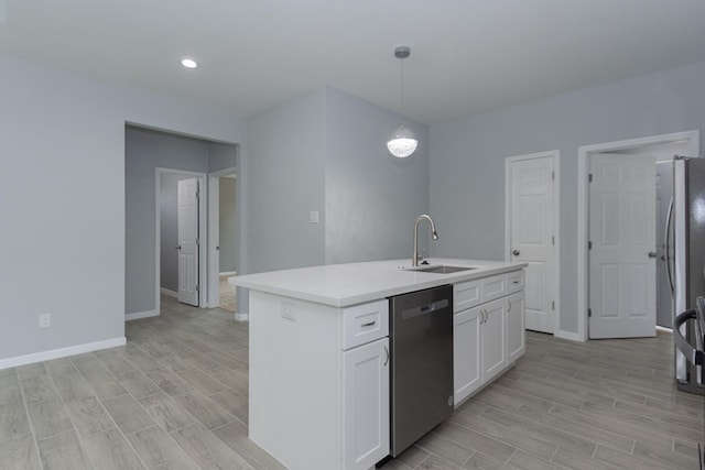 1022 Adams St, Cleveland, TX 77327 - kitchen with dishwasher, a sink, wood tiled floors, white cabinets, and recessed lighting