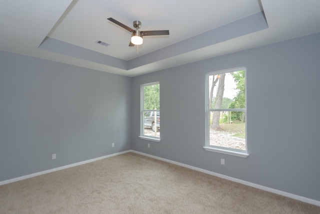 1022 Adams St, Cleveland, TX 77327 - unfurnished room featuring a raised ceiling, light colored carpet, baseboards, and ceiling fan