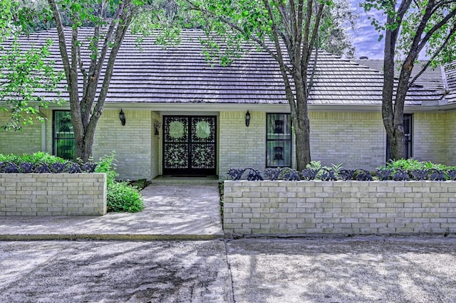 property entrance with brick siding