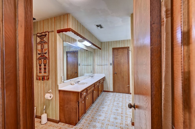 bathroom with toilet and vanity