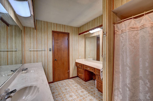 full bathroom featuring tile patterned floors, wallpapered walls, and vanity