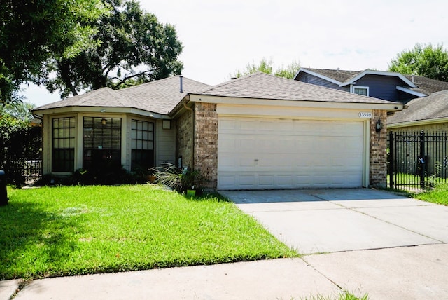 ranch-style home featuring a garage and a front lawn