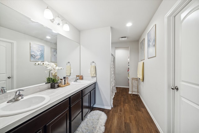 bathroom with vanity, hardwood / wood-style floors, and a shower with shower curtain