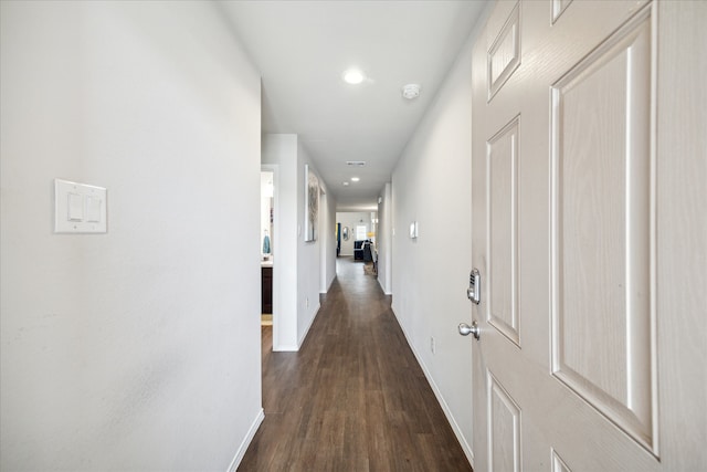 corridor featuring dark wood-type flooring