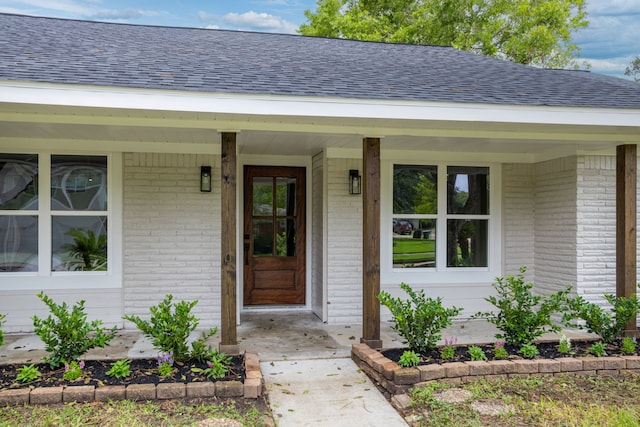 property entrance featuring covered porch