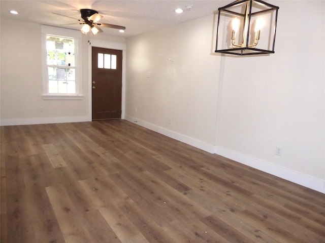 foyer with ceiling fan and dark wood-type flooring